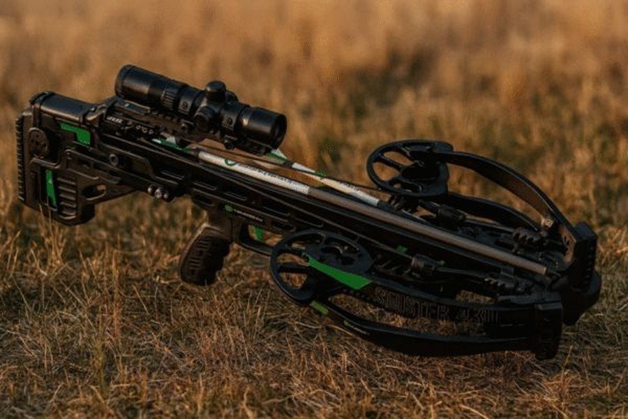 CenterPoint crossbow resting on grass during a field review