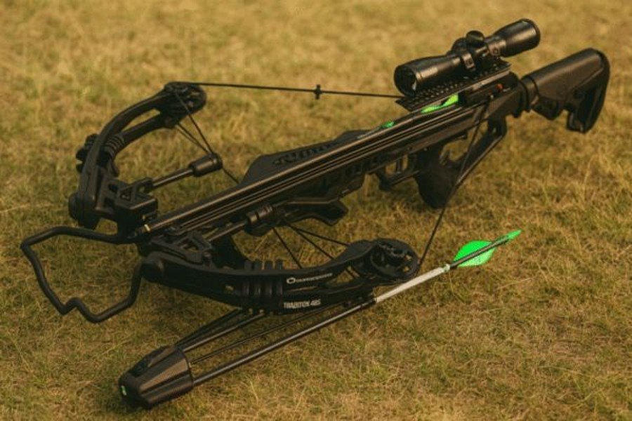 CenterPoint Tradition 405 crossbow with scope and arrow resting on grass