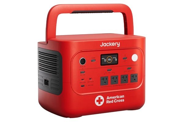 Red Jackery HomePower 2000 Plus v2 portable power station featuring American Red Cross branding and a built-in carrying handle.